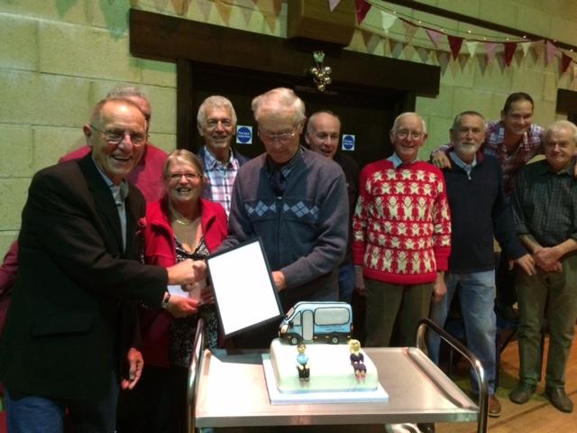 Bus drivers present certificate and cake to John and Olwen Smith